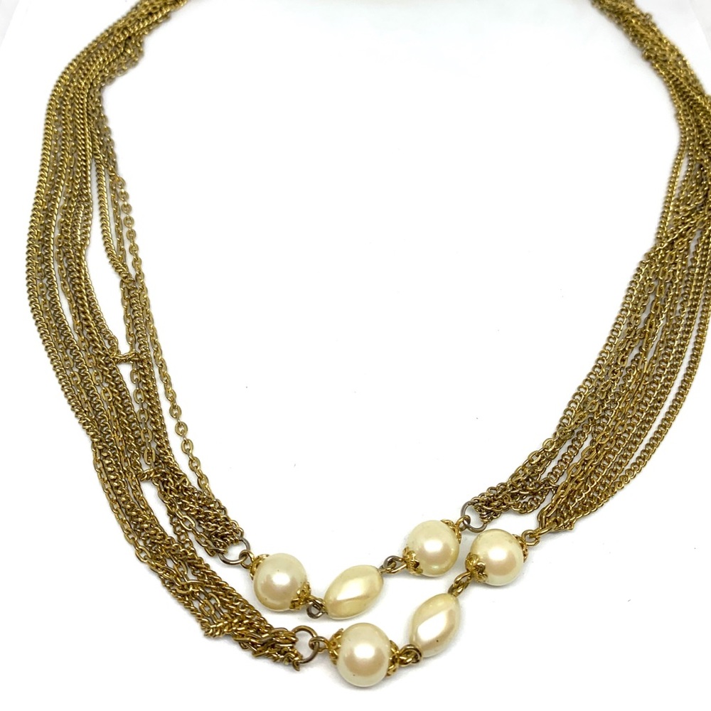 Super long multi strand gold tone and pearl